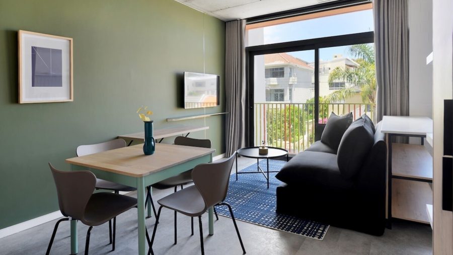 Open plan dining area, lounge and sliding doors onto Juliette balcony
